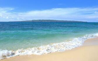 Tropical Ocean Wallpaper With A Distant Island Sight