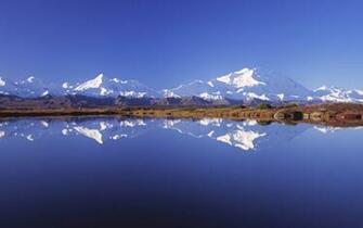 The Wallpaper Tall White Hills Reflected In Mirror Like
