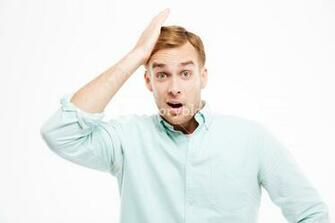 Portrait Of Surprised Handsome Young Businessman With Mouth Opened