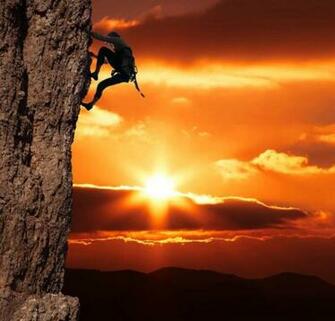 Climbing On The Rock Sunset Background Compressed