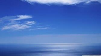 Calm Ocean And Blue Sky Wallpaper