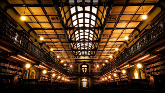 The Interior Of A Vast Library Impressive Collection 4k HD Wallpaper