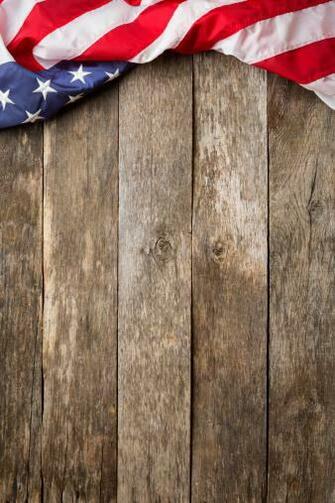 American Flag On Rustic Wooden Background Stock Photo Thinkstock