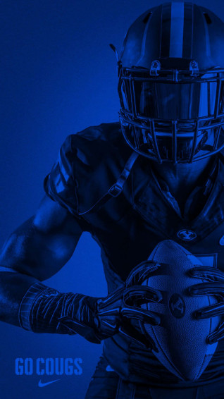 A Football Player Holding Ball Wallpaper