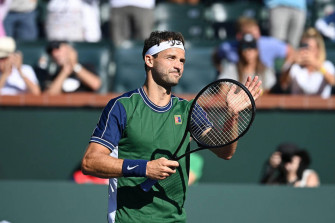 Grigor Dimitrov In Action On A Tennis Court Wallpaper