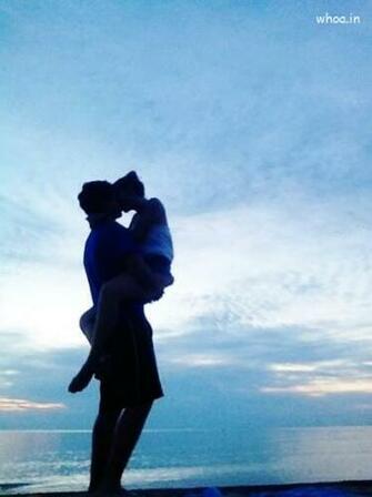 Couple Kiss Wallpaper On The Seashore For Mobile