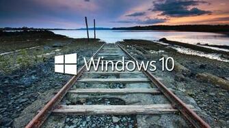 Windows White Text Logo On The Railroad Tracks Wallpaper