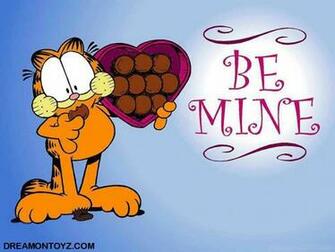Garfield The Cat Holding And Eating From A Heart Shaped Box Of