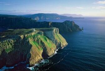 Tasman Island Lighthouse With Cape Pillar In The Background