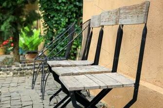 Set Of Vintage Wood Chairs Sitting In Row Green Terrace Nature