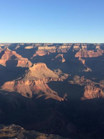 Brown Rocky Mountain Under Blue Sky During Daytime Photo