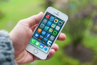 iPhone 5s White On A Background Of Leaves Wallpaper And Image