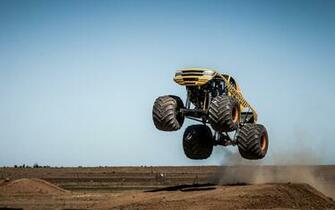 Monster Truck Jump Stop Action Wallpaper