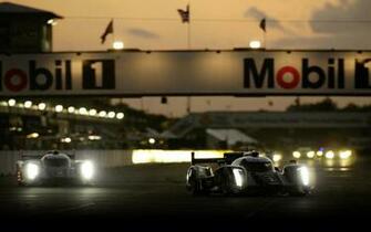 Audi Motorsport Race Cars At Le Mans During Night