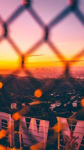 A Colorful Sunrise From Behind The Hollywood Sign X
