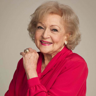 Betty White Smiling With Her Vibrant Energy Wallpaper