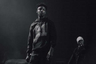 Atlanta Rapper Savage Performing On Stage Wallpaper