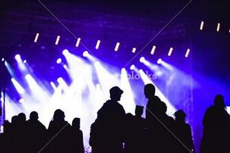 Group Of Friends Enjoying Music Festival Together Silhouette