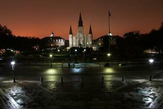 The Lights From Bourbon Street Reflect Off Fog And Silhouette St