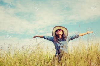 Sad Young Girl Sitting Alone On A Grass