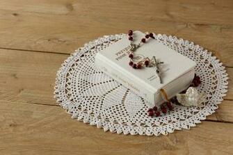 Brown And White Beaded Rosary On Covered Bible With Doily HD