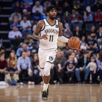 Kyrie Irving Drives To The Basket For Brooklyn Nets Wallpaper