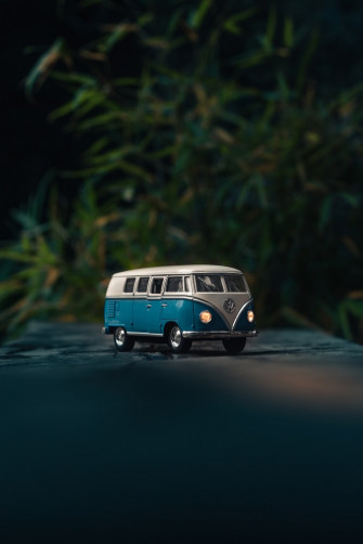 White And Blue Volkswagen T1 Van Toy On Gray Surface Photo