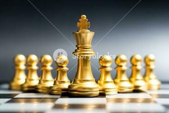 Gold King Chess Piece Stand In Front Of Pawn On Black Background
