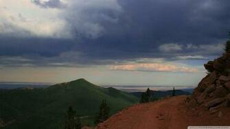 Stormy Skies Over Mountain Wallpaper