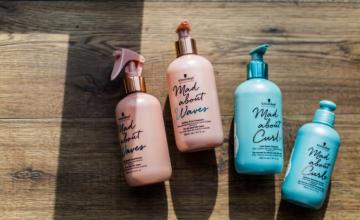 Four Mad About Curl And Waves Labeled Bottles On Wooden Surface