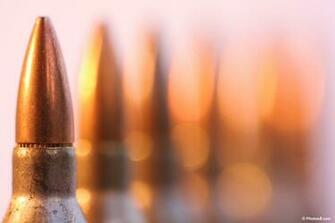 Assault Rifle Bullets Powerpoint Background Ppt