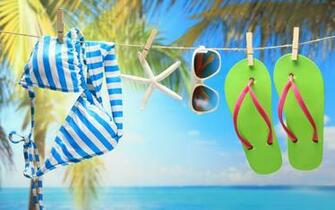 Swimwear Sunglasses And Green Flip Flops On The Beach Wallpaper By