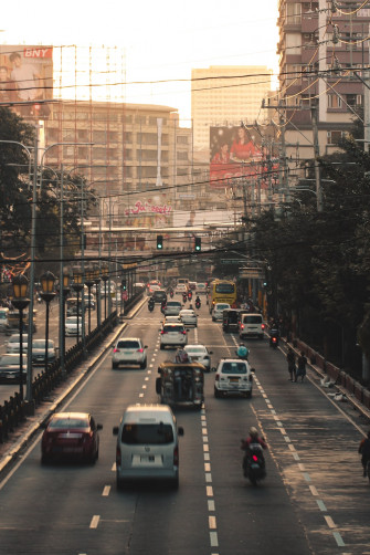 Cars On Road Near Buildings During Daytime Photo