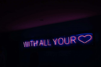 A Contrasting Neon Cityscape With Blurring Lights And