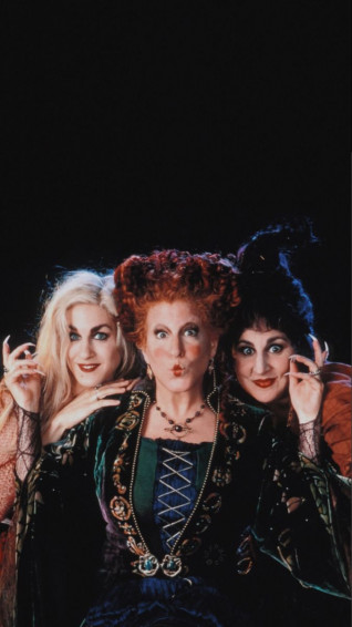 Three Women Dressed In Costumes Posing For The Camera Wallpaper