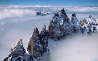 HD Mountain Peaks Above Clouds Wallpaper