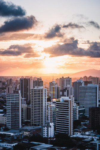 City Skyline Under Orange And Gray Cloudy Sky During Sunset Photo