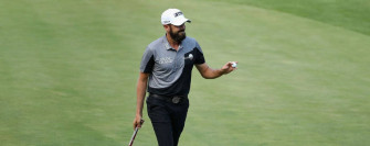 Professional Golfer Troy Merritt In Action On The Course Wallpaper