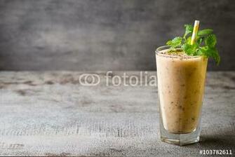Banana And Lemon Smoothie On The Grey Background Stock Photo