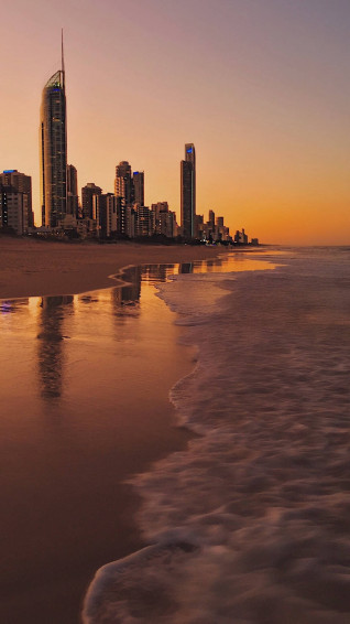 4k iPhone City During Sunset On Beach Wallpaper