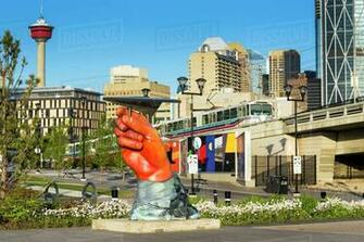 Large Hand Sculpture Holding A Metal Paper Plane With Commuter