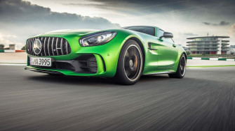 Zooming Green Colored Mercedes Amg Gt R Background Wallpaper
