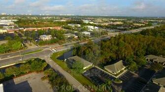 Aerial Of Suburban Setting W High Rise In Background License