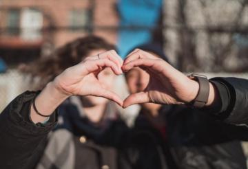 Two Person Combine Hand Forming A Heart Gesture Photo