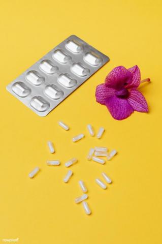 Pills And Medication On A Yellow Background Image By
