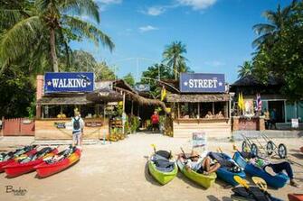 In West Railay Beach Thailand Several Canoes Are On The