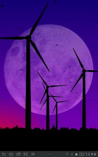 Description Wind Turbines Slowly Turning In The Out On A Field