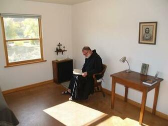 A Brother Doing Lectio Divina In His Cell Benedictine Abbey Of