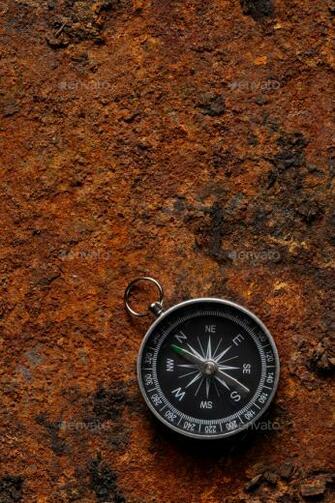 Magnetic Compass On Rough Rusty Background Stock Photo By