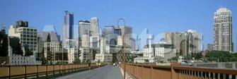 Stone Arch Bridge With Skyscrapers In The Background Minneapolis
